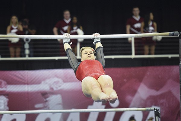 Arkansas' Sydney Laird performs on the bar during a gymnastics meet against Kentucky on Friday, Jan. 24, 2020, at Barnhill Arena in Fayetteville. 