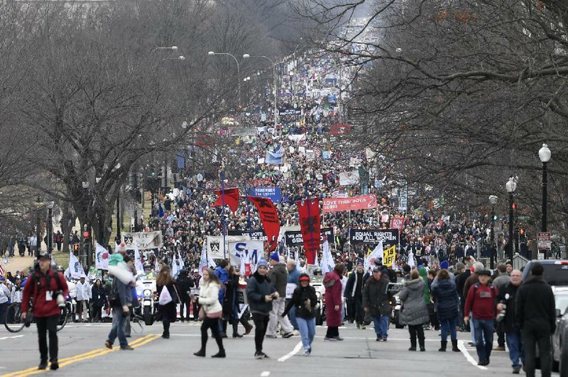 Marchers opposed to abortion fill the streets Friday in Washington as President Donald Trump’s campaign center announced a new coalition, “Pro-life Voices for Trump.”  