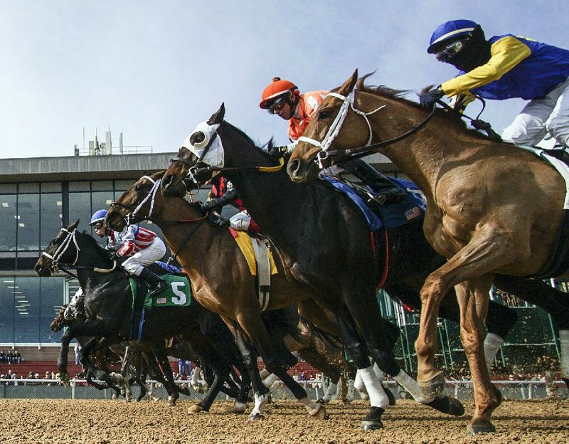 FILE — Horses and jockeys break from the starting gate at Oaklawn Racing Casino Resort in Hot Springs. (Democrat-Gazette file photo)