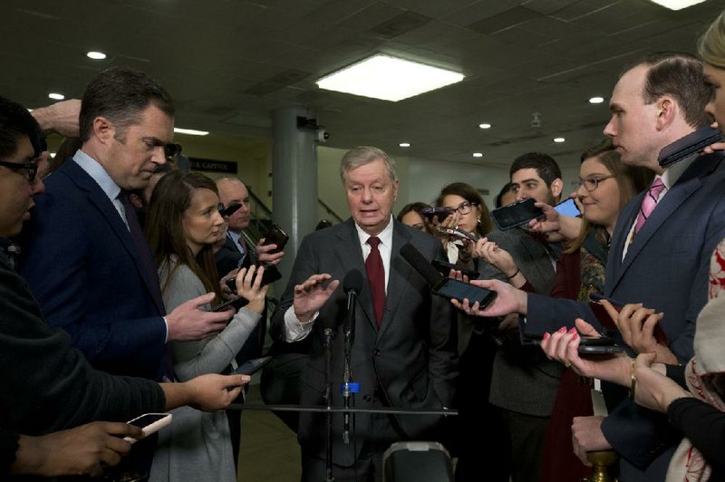 Sen. Lindsey Graham speaks with reporters Thursday before resumption of the impeachment trial in the Senate. Graham was absent from the proceedings when House impeachment manager Jerrold Nadler presented a 21-year-old clip of Graham, then a House manager for President Bill Clinton’s trial discussing what the Founding Fathers considered “high crimes.”
(AP/Jose Luis Magana)