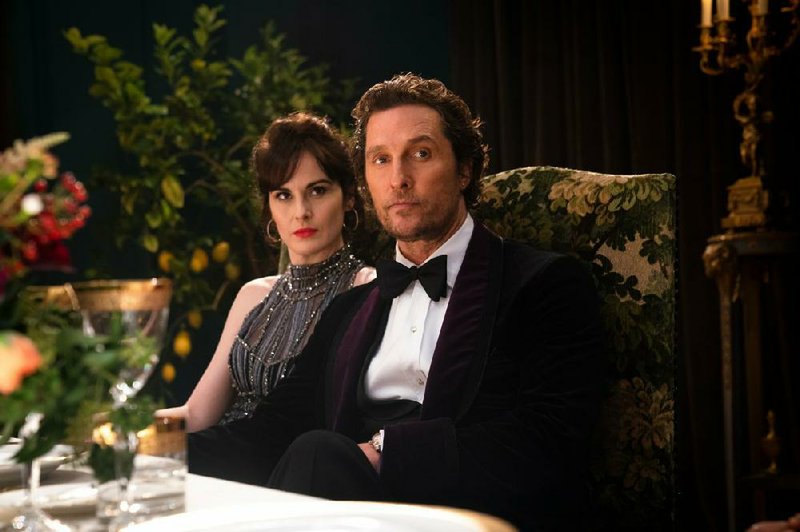 Rosalind (Michelle Dockery) and Mickey Pearson (Matthew McConaughey) try to sell off their multi-million dollar marijuana business to a group of British gangsters in Guy Ritchie’s The Gentlemen.