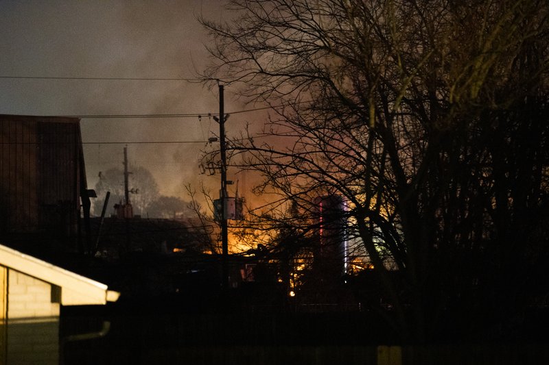 Flames fill the sky after an explosion early Friday destroyed a warehouse in Houston. Video is available at arkansasonline.com/125explosion/.  