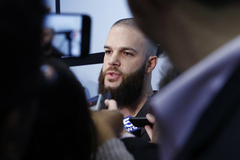 Chicago White Sox's Dallas Keuchel talks with reporters during the team's annual fan convention Friday, Jan. 24, 2020, in Chicago. (AP Photo/Charles Rex Arbogast)