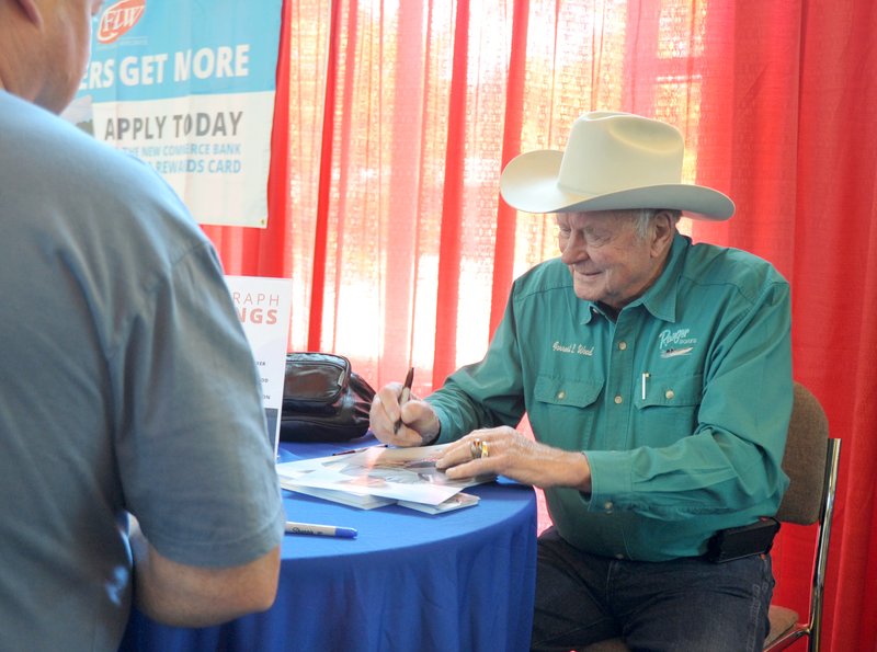 Forrest Wood signs autographs at the FLW Expo on Aug. 21, 2015. Wood, who founded Ranger Boats in 1968, died Friday at age 87. - The Sentinel-Record file photo