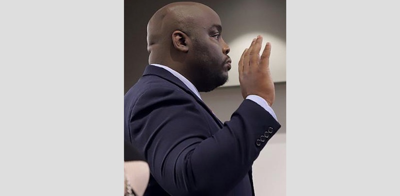Jeremy Cegers, superintendent and principal of the struggling Southeast Arkansas Preparatory High School, is sworn in Friday by the state Board of Education. story.lead_photo.caption