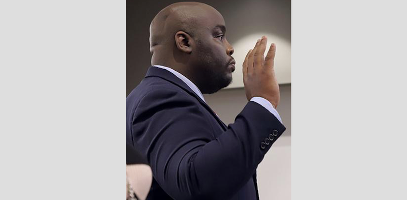 Jeremy Cegers, superintendent and principal of the struggling Southeast Arkansas Preparatory High School, is sworn in Friday by the state Board of Education. 