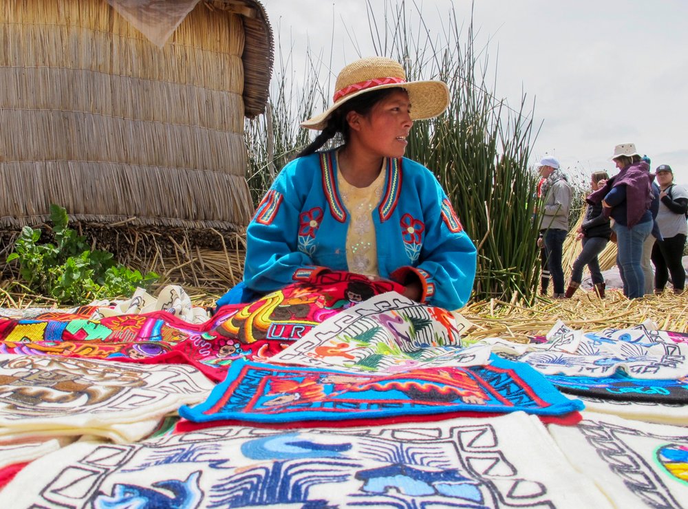 A young resident of a floating island on Lake Titicaca, an hour by boat from Puno, shares her work with visitors who have come to learn more about the traditional and modern ways of life on the island.
(TNS/Thomas Curwen)