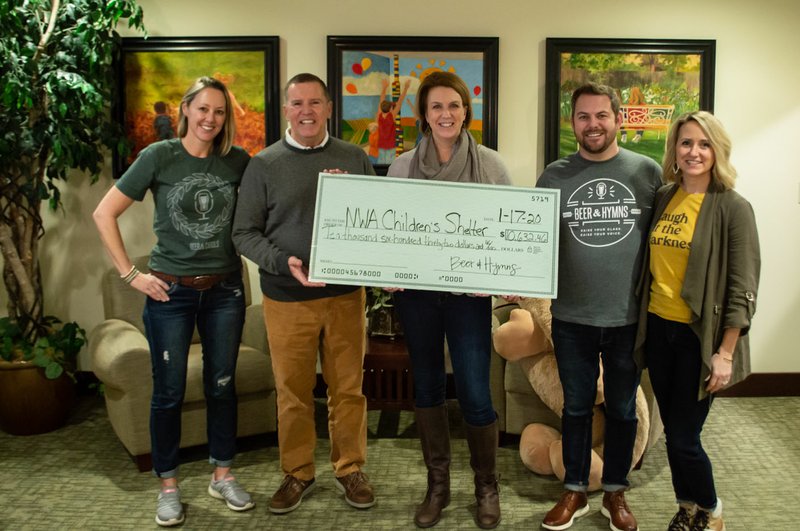 Beer &amp; Hymns, the only sing-along event raising funds for Northwest Arkansas nonprofits, presented a check for $10,632.46 to the Northwest Arkansas Children's Shelter Jan. 17. This was a record year for Beer &amp; Hymns charitable donations, quadrupling the total from 2018. The sing-alongs raised more than $53,593.54 in 2019, surpassing the $50,000 goal. Pictured (from left) are Kerry Moll, Beer &amp; Hymns Board member; Rick Brazile, interim executive director, Northwest Arkansas Children's Shelter; Carla Laing, development manager, Northwest Arkansas Children's Shelter; Ken Weatherford, founder, Beer &amp; Hymns; and Casey Weatherford, co-founder, Beer &amp; Hymns. (Courtesy Photo / Liz Emis)