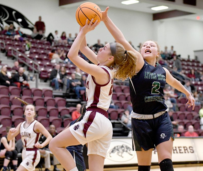 Bud Sullins/Special to Siloam Sunday Siloam Springs junior Sydney Moorman's shot is blocked by Little Rock Christian's Wynter Rogers. The Lady Warriors defeated the Lady Panthers 55-37 on Friday inside Panther Activity Center.