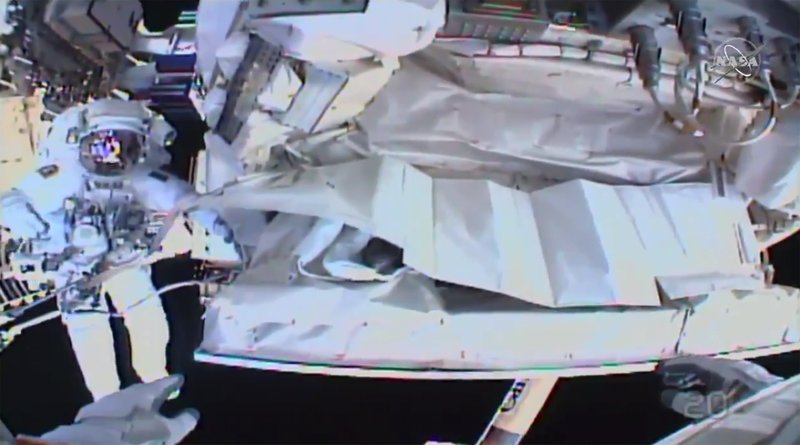 This photo provided by NASA shows the view from NASA's Andrew Morgan's helmet cam as Italian astronaut Luca Parmitano works outside the International Space Station during a spacewalk Saturday, Jan. 25, 2020. The astronauts worked to complete repairs to a cosmic ray detector outside the International Space Station.  (NASA via AP)