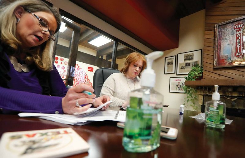 Jo Trizila (left), president and CEO of TrizCom Public Relations, conducts a meeting attended by employee Ann Littmann at Trizila’s offices in Dallas last week.
(AP/LM Otero)