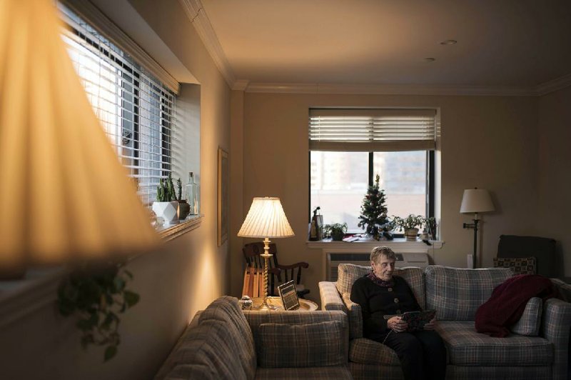 Gabrielle Wagner, 91, sits in her apartment at the Riverview senior facility in Manhattan, N.Y., in  December. She  thought she’d spend  the  rest of her days  there, but she’ll  relocate  to Harlem  in  March after selling some furniture to help pay for the move.
(The New York Times/Karsten Moran)