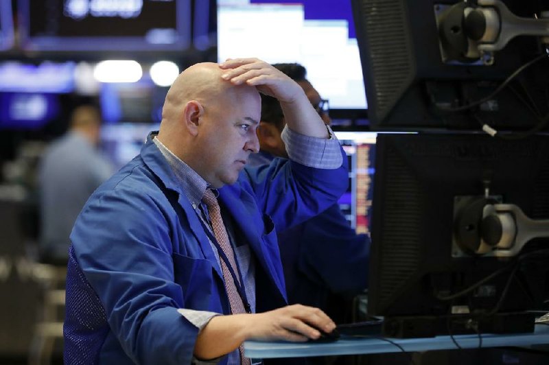 A trader works Monday on the floor of the New York Stock Exchange during a sell-off that affected a wide variety of sectors. 