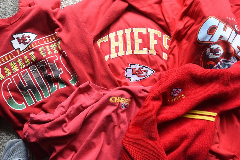 The author has no shortage of team apparel to choose from on Super Bowl Sunday. His lucky sweatshirt is on the left. (NWA Democrat-Gazette/Flip Putthoff)