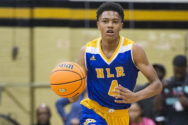North Little Rock guard Bryson Warren (4) dribbles the ball during a game against Little Rock Central on Friday, Jan. 10, 2020, in Little Rock.