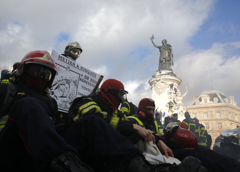 Firefighters gather for a demonstration Tuesday, Jan. 28, 2020 in Paris to demand a better pay and working conditions. (AP Photo/Christophe Ena)