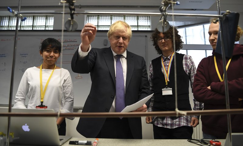 Britain's Prime Minister Boris Johnson, center left, visits the Department of Mathematics at King's Maths School, part of King's College London University, in London, Monday Jan. 27, 2020. (Daniel Leal-Olivas/Pool via AP)