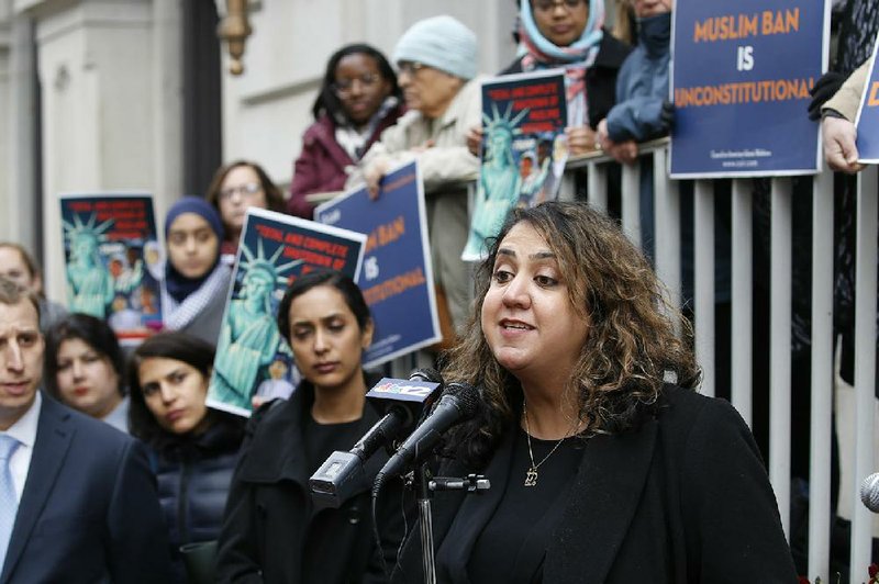“Ultimately, this is dividing our families and keeping us apart,” said Mana Kharrazi, an Iranian-American who is a plaintiff in one of the lawsuits challenging the travel ban. More photos at arkansasonline.com/129ban/.
(AP/Steve Helber)