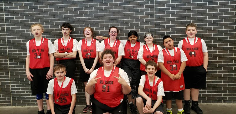 Courtesy Photo The McDonald County Special Olympic 5-on-5 basketball team took second place on Jan. 25 at a tournament in Neosho. Front row, left to right: Dakota Bullington, Carmon Wahleithner and James Lay. Back row: Dylan Dean, Jack Leib III, Shelly McDonald, Kori Bullington, Shellea Collins, Mendy Barnes, Mario Moreno and Zane McGuffey.