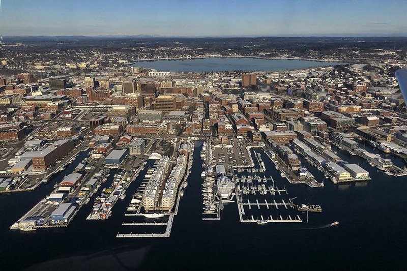 Commercial fishing, industry, travel and tourism contribute to commercial activity at the waterfront in Portland, Maine. U.S. consumer spending moderated and business investment continued to deteriorate in the last quarter of 2019, while a smaller trade deficit and more home construction helped keep economic growth steady.
(AP/Robert F. Bukaty)