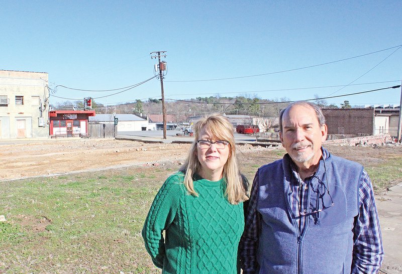 Jerry Smith, right, president and CEO of the Morrilton Area Chamber of Commerce and the Conway County Economic Development Corp., surveys the site of the forthcoming Holyfield Plaza with Stephanie Lipsmeyer, director of events and membership services for the chamber.