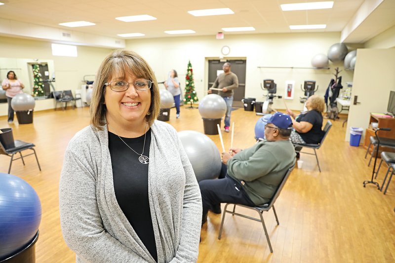 Jacksonville Senior Wellness and Activity Center Director Christy McMillion visits the Drums Alive class at the center. The cardio program combines music and low-impact movement.