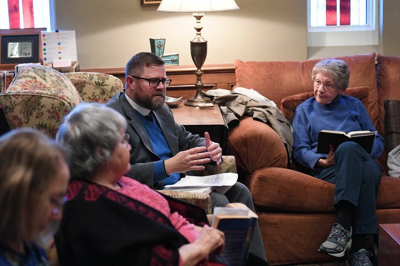 The Rev. Evan D. Garner, rector of St. Paul's Episcopal Church in Fayetteville, leads a Bible study group earlier this week. Garner was nominated as a candidate for the position of bishop of Alabama, but he says he's delighted he wasn't the one God called to fill the post. (NWA Democrat-Gazette/J.T. Wampler)