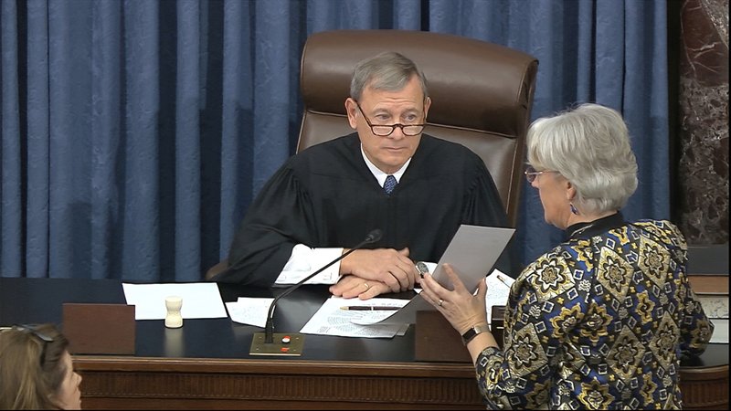 Chief Justice John Roberts, the presiding judge in the impeachment of President Donald Trump, prepares to read the result of the vote on allowing witnesses and evidence in the Senate trial.
(AP/Senate Television)