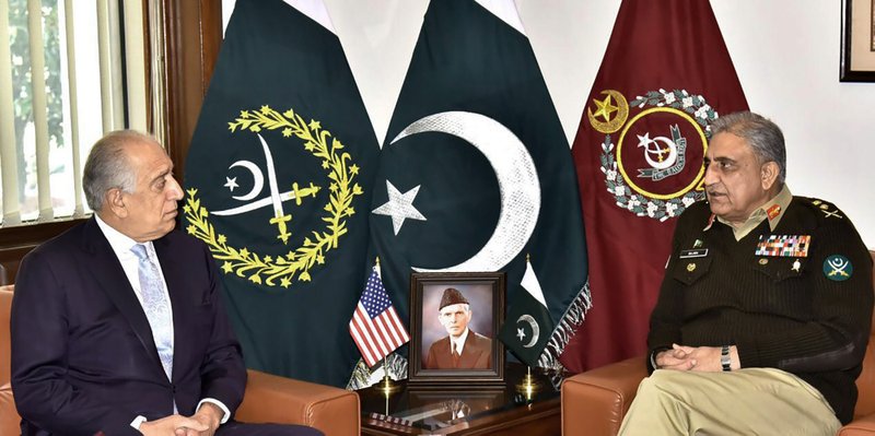 In this photo released by Inter Services Public Relations of Pakistan's military, U.S. peace envoy Zalmay Khalilzad, left, talks with Pakistani Army Chief Gen. Qamar Javed Bajwa during a meeting in Rawalpindi, Pakistan, Friday, Jan. 31, 2020. During the meeting, matters of mutual interest including overall regional security situation and ongoing Afghanistan Reconciliation Process were discussed, official said.(Inter Services Public Relations via AP)