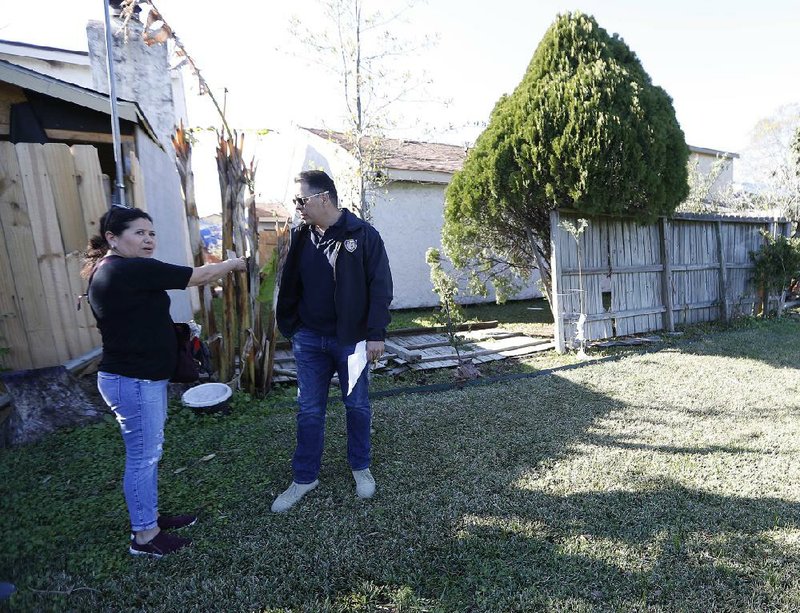 Houston Fire Chief Samuel Pena meets last week with Hortensia Lima, whose home was damaged and deemed uninhabitable after the explosion last month.  