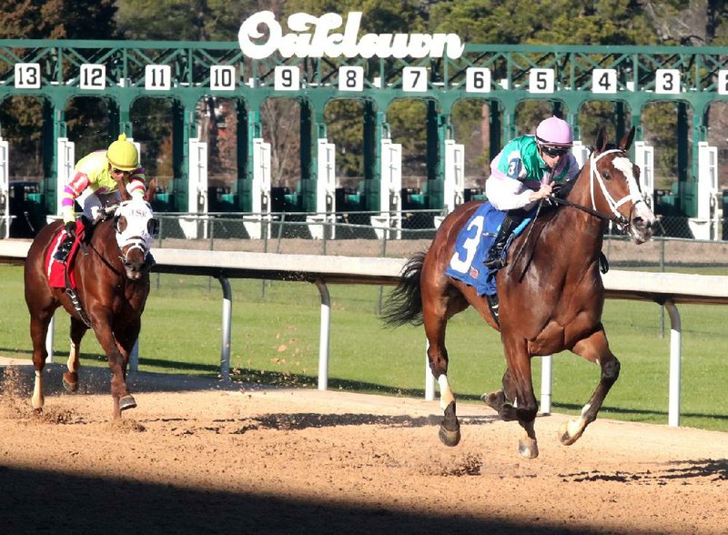 Florent Geroux and Taraz (3) draw clear in stretch from O Seraphina (1) and jockey Martin Garcia to win the Martha Washington Stakes on Saturday at Oaklawn in Hot Springs. Taraz’s winning time was 1:38.64 for the 1-mile race.