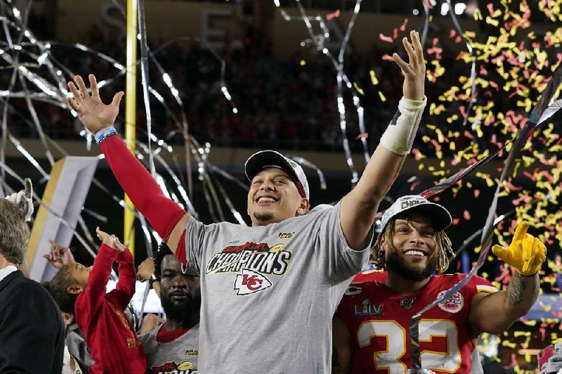 Kansas City’s Patrick Mahomes (left) and Tyrann Mathieu celebrate after the Chiefs scored 21 points in the fourth quarter to rally to a 31-20 victory over the San Francisco 49ers in Super Bowl LIV on Sunday in Miami Gardens, Fla. Mahomes, who rushed for a touchdown and also threw for 286 yards and two scores, was named the game’s MVP. More photos at arkansasonline.com/23sbgallery/