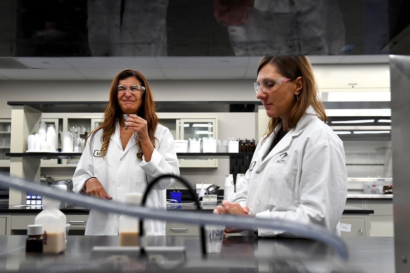 Marie Wright, vice president and chief global flavorist at Archer Daniels Midland, doesn't like the taste of the first of four samples of a protein shake that Joy Merritt is working on. (The Washington Post/Katherine Frey) story.lead_photo.caption