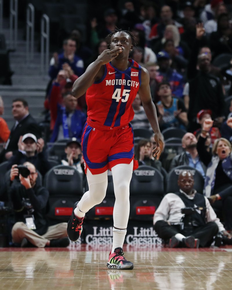 Detroit Pistons forward Sekou Doumbouya reacts after a three-point basket during the first half of an NBA basketball game against the Denver Nuggets, Sunday, Feb. 2, 2020, in Detroit. (AP Photo/Carlos Osorio)