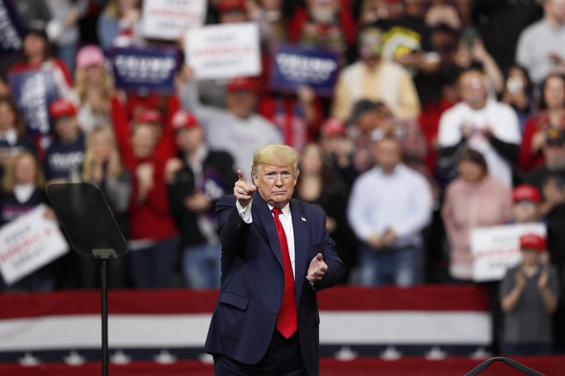 President Donald Trump reacts to audience members during a campaign rally at Drake University, Thursday, Jan. 30, 2020, in Des Moines, Iowa. (AP Photo/Charlie Neibergall)