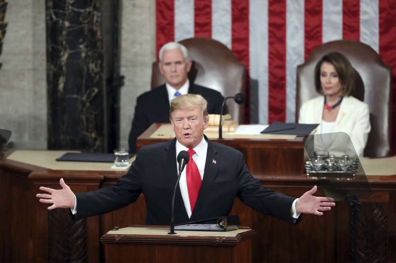 FILE - In this Feb. 5, 2019, file photo, President Donald Trump delivers his State of the Union address to a joint session of Congress on Capitol Hill in Washington, as Vice President Mike Pence and Speaker of the House Nancy Pelosi, D-Calif., watch. (AP Photo/Andrew Harnik, File)