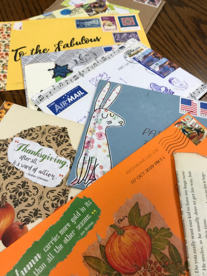 Pat Kirby has a collection of letters she's received from pen pals far and near. (NWA Democrat-Gazette/Becca Martin-Brown)