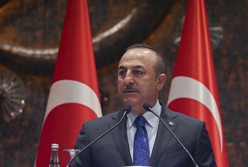 Turkish Foreign Minister Mevlut Cavusoglu speaks during a meeting in Ankara, Turkey, Tuesday, Feb. 4, 2020. Cavusoglu said Tuesday Ankara and Moscow were trying to keep peace efforts for Syria alive despite Syrian government advances and a deadly clash between Turkish and Syrian forces in northern Syria. (Turkish Foreign Ministry via AP, Pool)