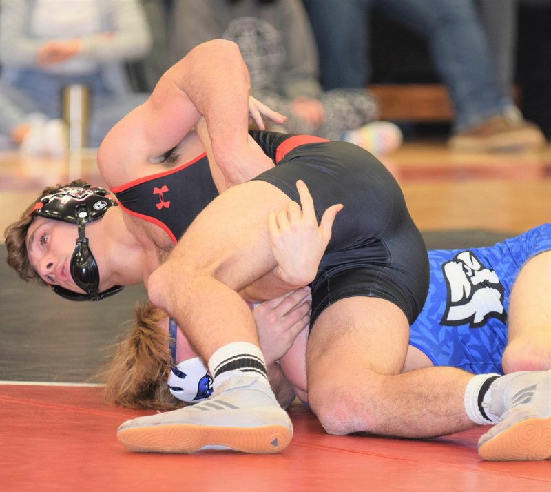 RICK PECK/SPECIAL TO MCDONALD COUNTY PRESS McDonald County's Jack Teague has Isaiah Ragsdale of Marshfield on his back on the way to a third-period pin during the Mustangs' 40-36 loss on Jan. 30 at MCHS. On Saturday, Teague won the 152-pound championship at the 2020 George Hoover Invitational on Feb. 1 at Liberty High School.