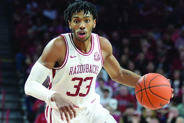 Arkansas guard Jimmy Whitt (33) looks to drive to the lane Saturday, Jan. 25, 2020, during a game against TCU in Bud Walton Arena. 