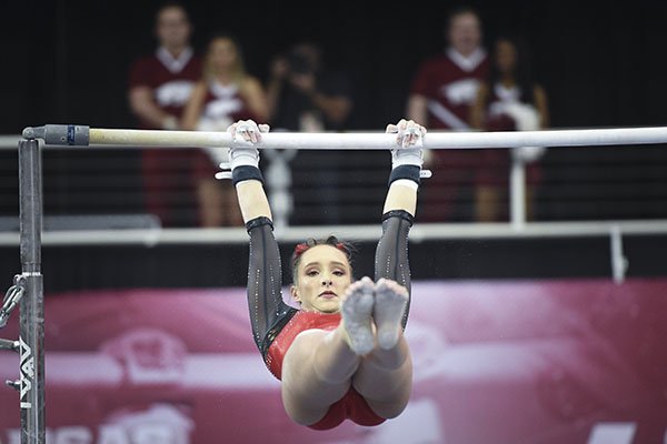 Arkansas' Kennedy Hambrick performs on the bar during a gymnastics meet against Kentucky on Friday, Jan. 24, 2020, at Barnhill Arena in Fayetteville.