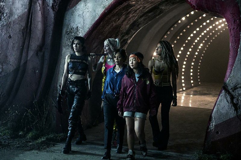 From left, Helena “Huntress” Bertinelli (Mary Elizabeth Winstead), Harley Quinn (Margot Robbie), Renee Montoya (Rosie Perez), Cassandra Cain (Ella Jay Basco) and Dinah “Black Canary” Lance (Jurnee Smollett-Bell) prowl the Gotham City night in Birds of Prey. 