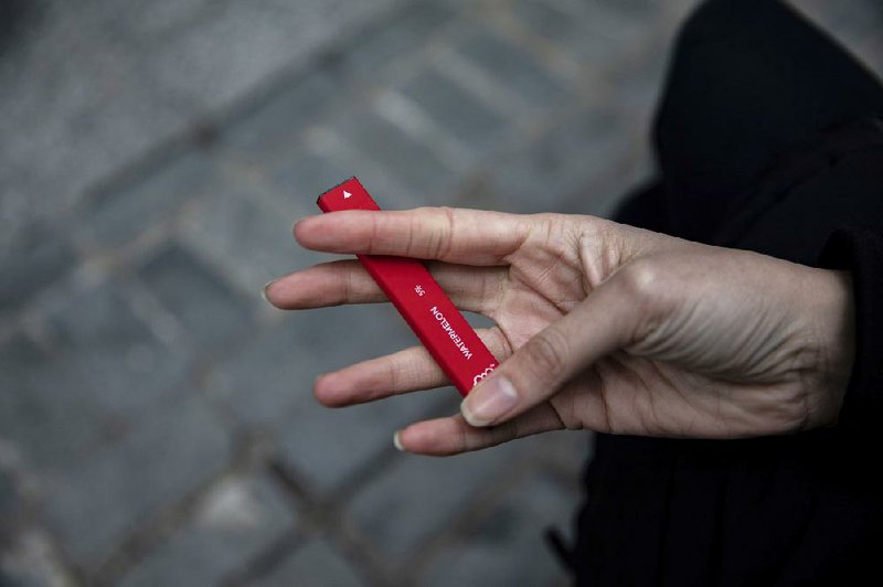 U.S. regulators are banning refillable flavored e-cigarettes, but the rules don’t apply to disposable vaping devices like this one called a Puff Bar.  