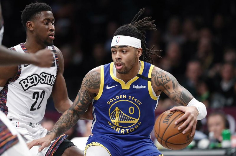 D’Angelo Russell (0) was traded Thursday from the Golden State Warriors to the Minnesota Timber- wolves for Andrew Wiggins.