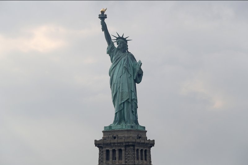 FILE - In this Aug. 14, 2019 file photo, The Statue of Liberty is shown in New York. The Department of Homeland Security says New York residents will be cut off from &#x2018;trusted traveler&#x2019; programs because of a state law that prevents immigration officials from accessing motor vehicle records. Acting Deputy DHS Secretary Ken Cuccinelli says tens of thousands of New Yorkers will be inconvenienced by the action. (AP Photo/Kathy Willens)