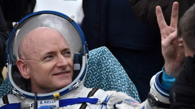 International Space Station crew member Scott Kelly of the U.S. shows a victory sign after landing near the town of Dzhezkazgan, Kazakhstan. [Associated Press]