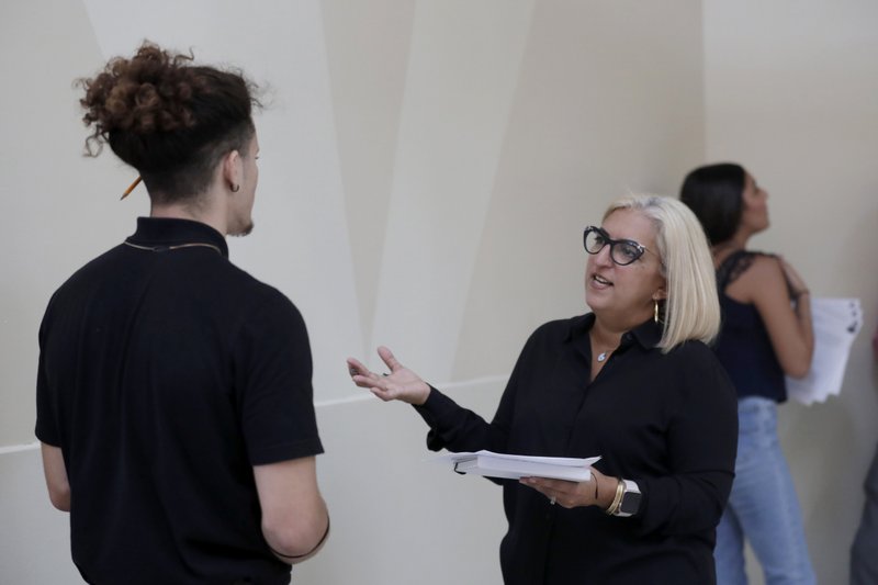FILE - In this Oct. 1, 2019, file photo, Gory Rodriguez, of Starbucks, right, interviews a job applicant during a job fair at Dolphin Mall in Miami. The January U.S. jobs report on Friday, Feb. 7, 2020, may provide timely evidence of the U.S. economy's enduring health. (AP Photo/Lynne Sladky, File)