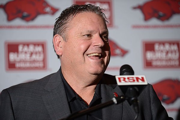 Arkansas coach Sam Pittman speaks Wednesday, Feb. 5, 2020, about the Razorbacks' signees with members of the media inside the Fred W. Smith Football Center on the university campus in Fayetteville.