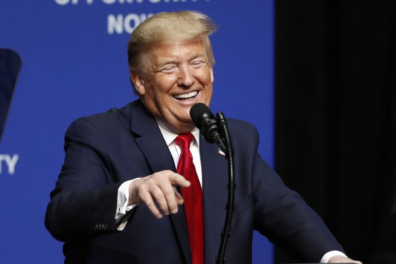 President Donald Trump laughs while delivering comments during the North Carolina Opportunity Now Summit in Charlotte, N.C., Friday, Feb. 7, 2020. (AP Photo/Gerry Broome)