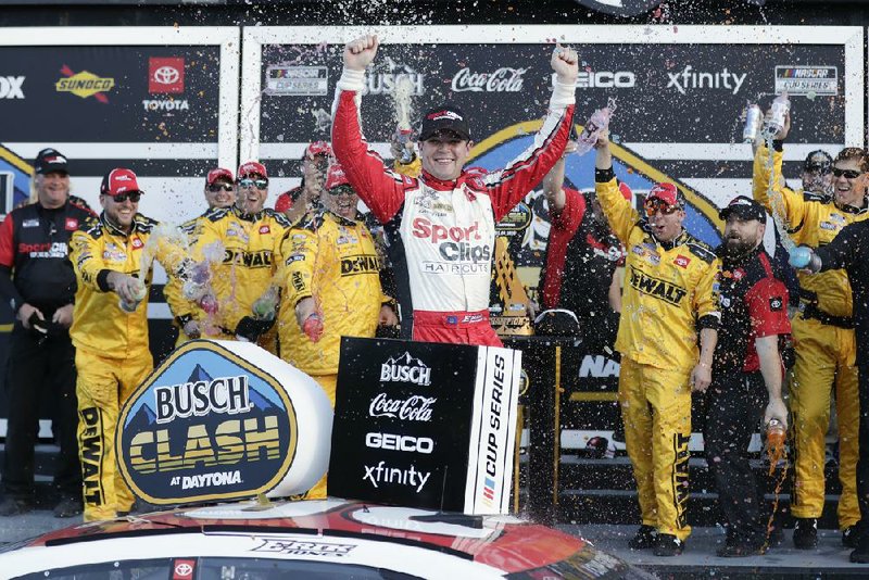 Erik Jones celebrates with team members in Victory Lane on Sunday after winning the NASCAR Busch Clash at Daytona International Speedway in Daytona Beach, Fla.